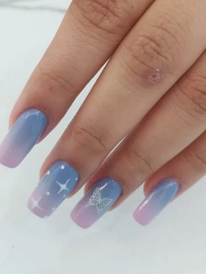 Another view of the butterfly and stars design on square nails.