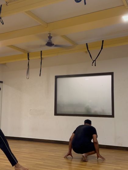 A student demonstrates the transition from a cartwheel to a handstand, a drill that builds control and fluidity. This shows how we link different movements together to create seamless sequences.