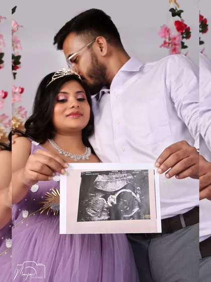 A first look at their baby. This couple shares a precious moment looking at the sonogram, captured beautifully in our whimsical swing setup.