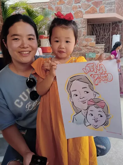 A lovely mother-daughter duo from Korea with their caricature. Art truly has no language barrier and brings smiles to people from all over the world.