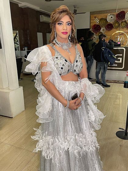 A full-on glam look. This silver and white lehenga is a statement piece, and I created a makeup look with bold eyes and a glowing complexion to match.