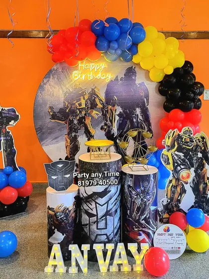 A Transformers theme for the action-loving kid. This setup includes large character cutouts, a custom backdrop, and a balloon arch in primary colors.