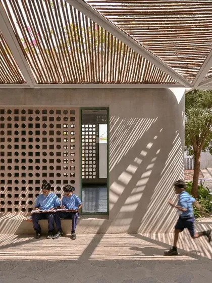 We love the play of light and shadow at the Talaricheruvu Rural School in Andhra Pradesh. The bamboo canopy and perforated jaali walls create a dynamic, comfortable environment for the children, showcasing how thoughtful design can have a profound social impact.