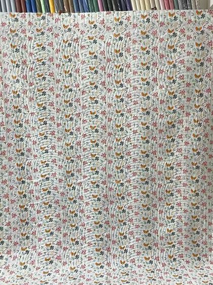 A full view of the charming backing fabric for the red and white star quilt.