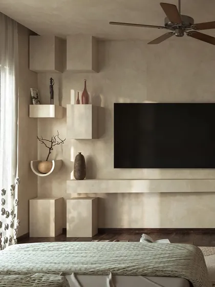The TV wall features sculptural, block-like shelves, adding a raw, organic aesthetic. The entire space is designed to slow the senses and create a sanctuary of calm.