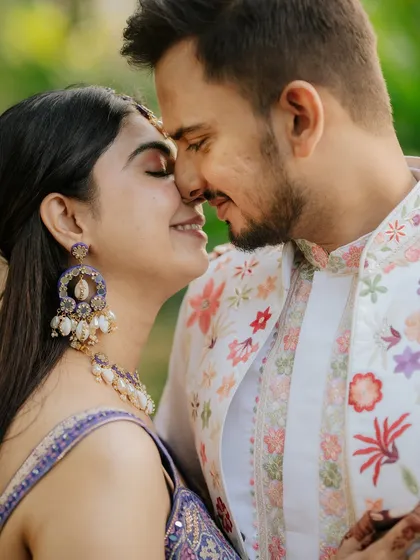 An intimate close-up portrait showing the beautiful details of the bride-to-be's jewelry and the couple's gentle connection.