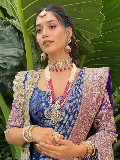 A poised and regal portrait, perfect for showcasing a high-fashion bridal or reception look.