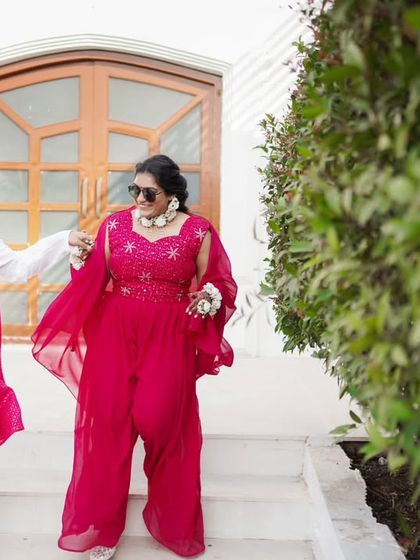 A fun, stylish shot of the couple making their entrance at the Haldi event.