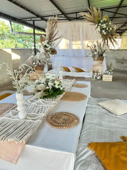 Another angle of the boho bridal shower, showing the detailed macrame table runner and low seating. Every element is chosen to contribute to a relaxed and stylish vibe.