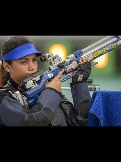 A focused shot of our athlete Apurvi Chandela during a competition, showcasing the calm and steady presence we cultivate.