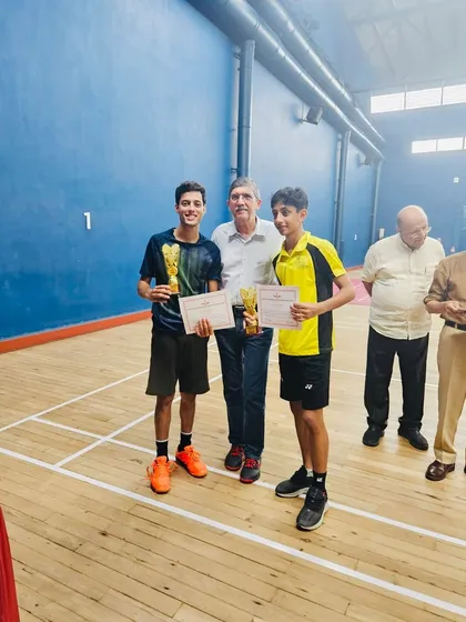 Zehn and his doubles partner receiving their awards at the FOZAWAC tournament. Teamwork and synergy are key components of our doubles training program.