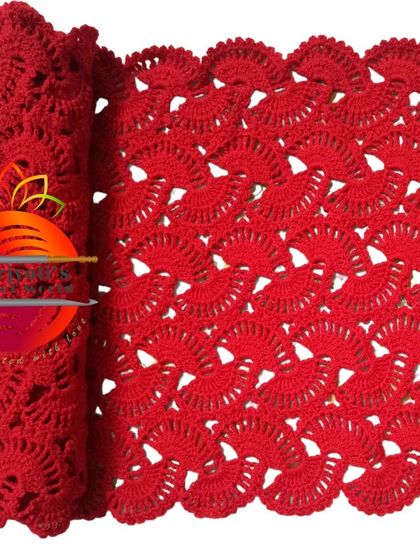 A close-up of the lacy stole in a vibrant red. The openwork pattern makes it lightweight and elegant, perfect for draping over your shoulders.