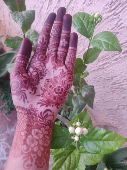 Here is the same hand after the paste has been removed and the stain has fully developed. You can see the beautiful, deep maroon color that my organic henna produces.