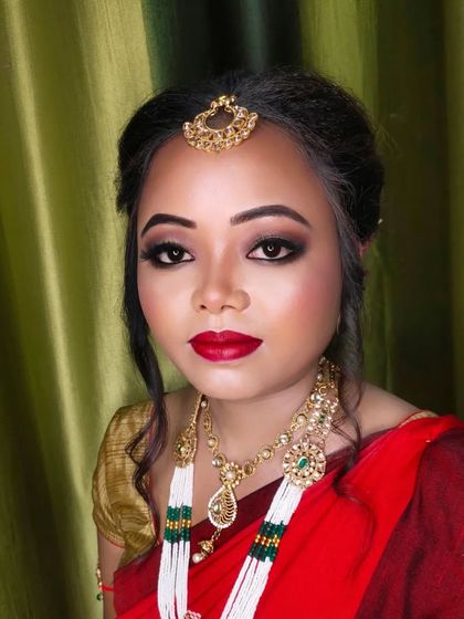 A final portrait of this traditional bridal look. The combination of bold makeup and intricate jewelry is timeless.