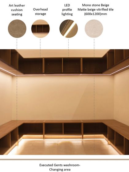The executed changing area features ample overhead and low-level storage, crafted from warm wood. Art leather cushion seating provides comfort, while recessed LED profile lighting creates a calm and inviting atmosphere for members.