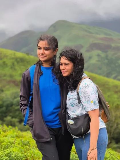 Two friends enjoying the scenic beauty of the Kudremukha trek. It's an adventure best shared.