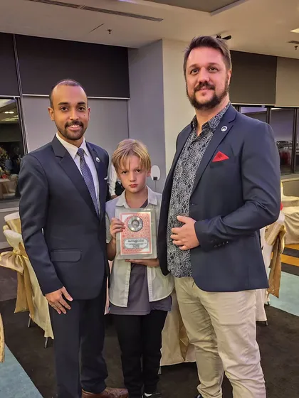 With a young, talented martial artist and his mentor. It is inspiring to see the next generation of athletes being guided by dedicated coaches.