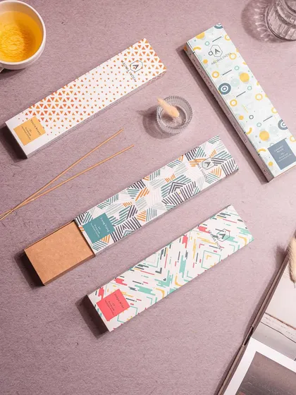 Purify your surroundings and welcome positivity with our artistically packaged incense sticks. The modern, geometric designs on the boxes make them a stylish addition to any home.