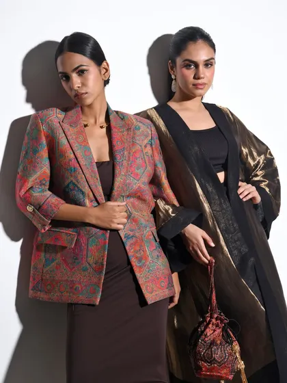 For this Indian fashion campaign, I focused on creating a look of modern royalty. The styling pairs a contemporary printed blazer with a metallic, flowing kaftan, showcasing how traditional textiles can be worn with a sharp, elegant edge.