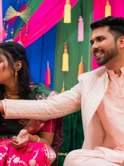 A playful moment from a Maharashtrian wedding ritual, filled with laughter and fun.