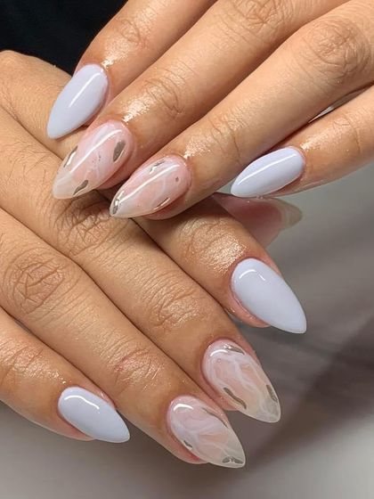 A lovely set with light blue nails and a white marble effect on the accent nails. This is a fresh and clean design.