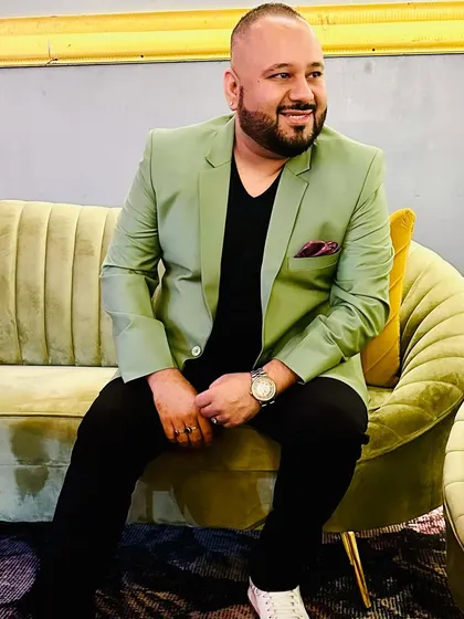 Banging it loud this wedding season. A relaxed shot of me on a couch before a gig, ready to bring the energy.