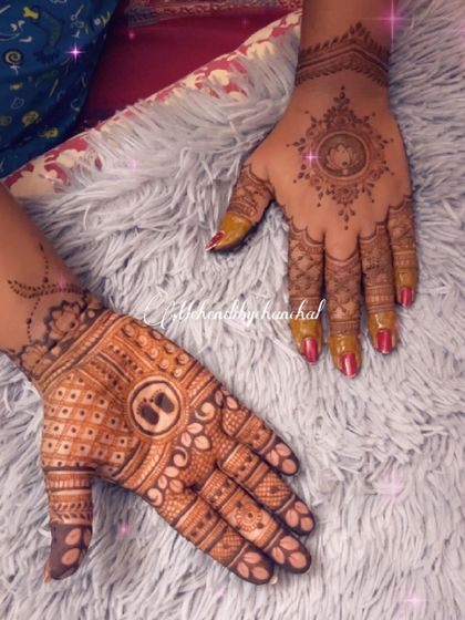 A simple yet meaningful baby shower design. One hand has the baby feet motif, while the other has a lotus mandala.