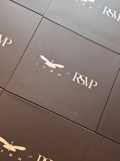 A grid of the custom-branded boxes for the Itrh for RSVP collaboration, demonstrating our capability for large-scale, uniform production.