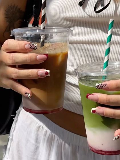 Coffee date with a friend. We both have our fresh, custom nail sets.