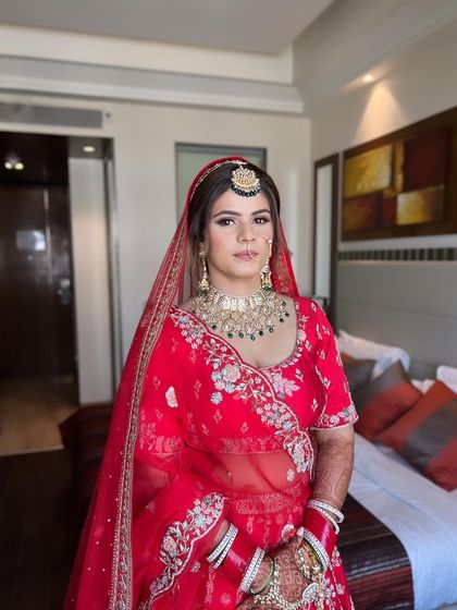 There's a special glow that morning brides have. This look features fresh skin and a pop of red on the lips, perfect for a daytime wedding ceremony.