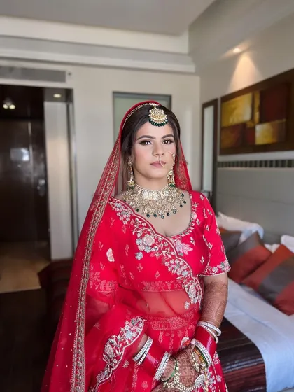 There's a special glow that morning brides have. This look features fresh skin and a pop of red on the lips, perfect for a daytime wedding ceremony.