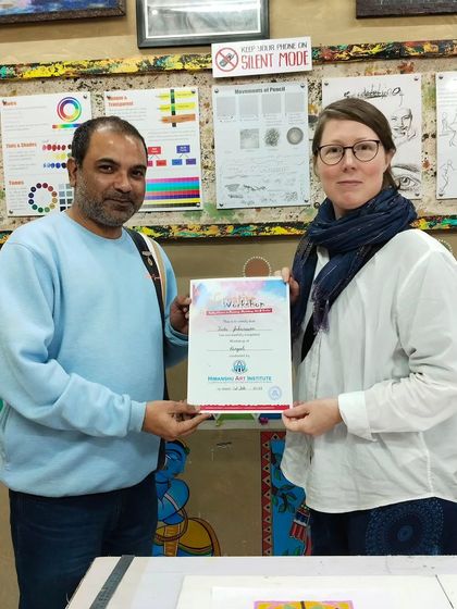 Another student from abroad proudly holding her workshop completion certificate. Art truly has no borders at our institute.