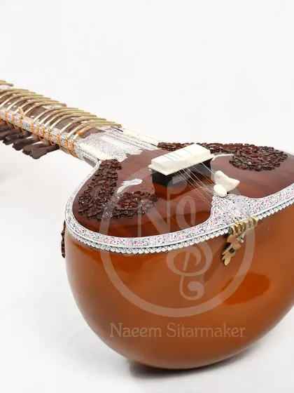 A close-up angle of a Pandit Ravi Shankar style sitar. The double tumba design is clearly visible, which adds to the instrument's sustain and resonance.