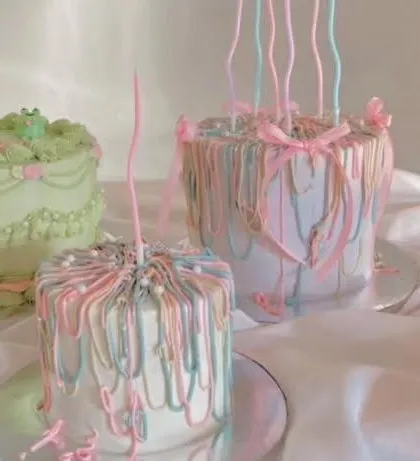 A collection of my custom-designed cakes, including the popular pastel ribbon style. I can recreate your favorite designs for any celebration.