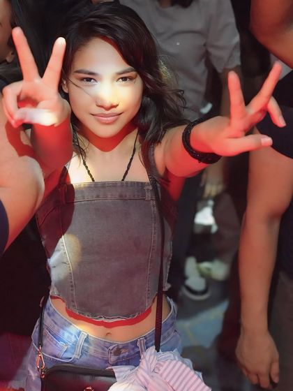 A guest flashing a peace sign. It's all about good vibes and positive energy.
