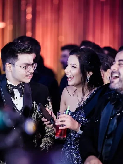 Capturing the genuine laughter and interactions between the couple and their friends is key to telling the story of the party.