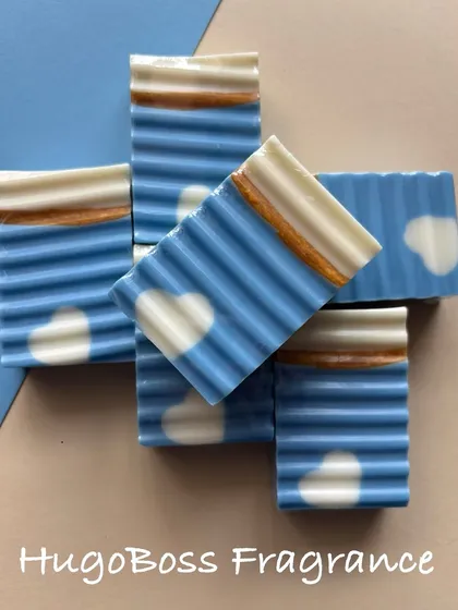 This is one of my classic designer bars, featuring a calming blue design with little hearts. It has a sophisticated Hugo Boss fragrance and is made with my signature moisturizing camel milk base, perfect for daily pampering.