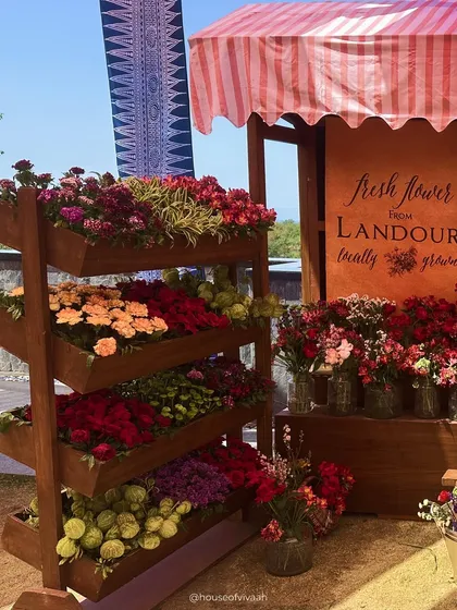 A charming "Fresh Flower from Landour" stall, filled with colorful, locally-grown flowers, adding an interactive and authentic touch to the Pahadi-themed event.
