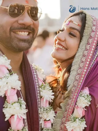 A modern couple shares a happy moment during their Varmala ceremony. I help find matches where traditional values and modern sensibilities align perfectly.
