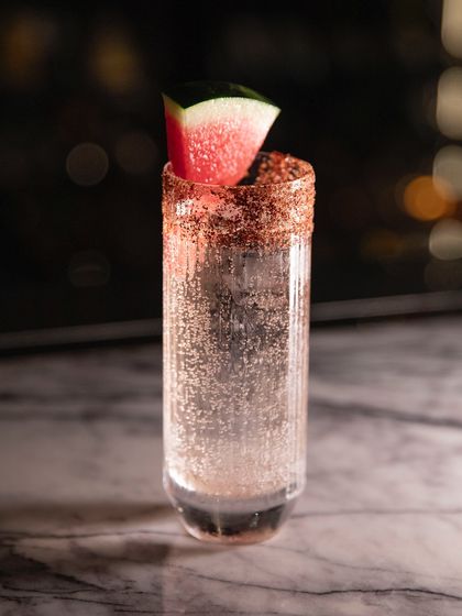 One of our signature cocktails, served at the Stella takeover in Bangkok. This drink features a refreshing watermelon garnish and a spiced rim, a perfect example of how we blend familiar flavours with an Indian twist.