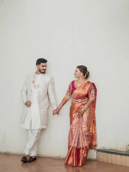 A full-length shot of the couple, showcasing their coordinated outfits and creating a picture of pure elegance and love.