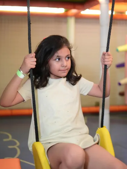 A moment of quiet contemplation on our gentle swings. We have activities suited for every mood, whether your child wants high-energy fun or a calm moment.
