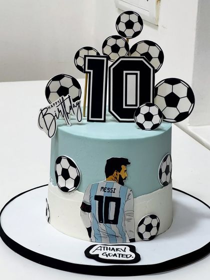 A perfect kick-off to turning 10! This football-themed cake for a young champion features Messi, bold colors, and sporty details to score birthday goals in style.