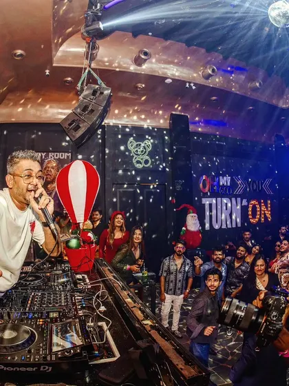 On the mic at Toy Room, Pune, getting the crowd hyped for the next drop. Direct interaction is a key part of every one of my performances.