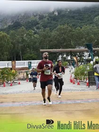 Approaching the finish line at the Nandi Hills Monsoon Run. This event is known for its challenging terrain, and our training prepares you for exactly these kinds of conditions.