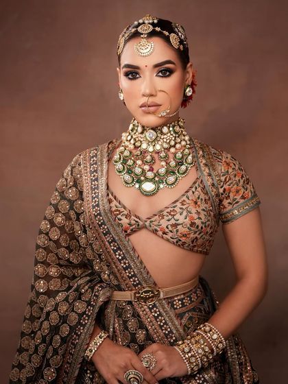 A powerful stance, showcasing the entire bridal ensemble and the bold makeup.