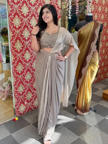 Feel effortlessly glamorous in this ready-to-wear drape saree. The combination of a sparkling blouse and a pre-draped skirt gives you a cocktail-ready look in minutes.