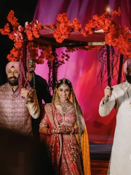 A modern take on the phoolon ki chaadar, crafted with vibrant red florals. Every detail, from the groom's baraat to the bride's entry, is thoughtfully designed to be both traditional and stylish.