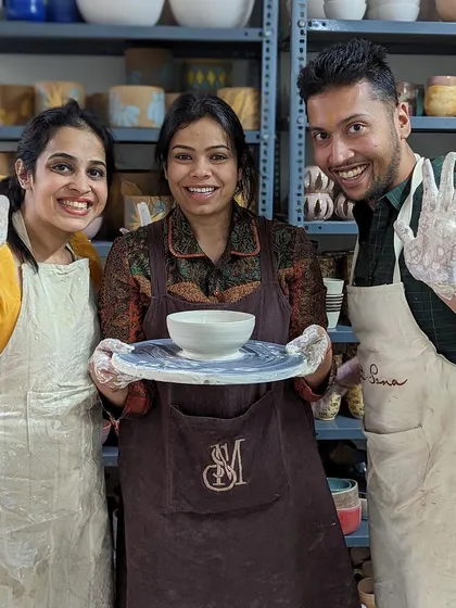 Happy faces and muddy hands after a successful pottery session. We love seeing our students proud of their work.