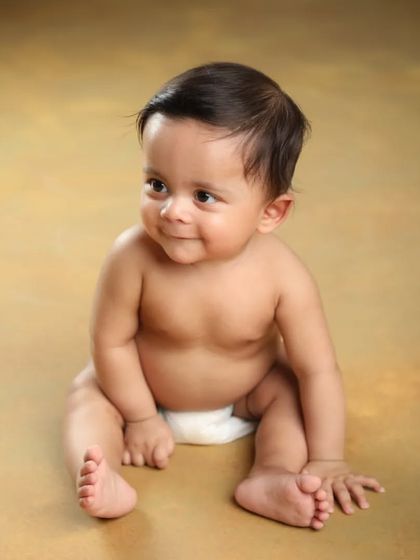 That little smile is everything! Simple, classic portraits on a solid background are perfect for capturing every sweet expression.
